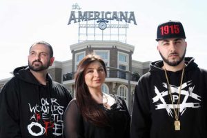 Alex Kodagolian, Tina Chuldzhyan and Armin Hariri, a rapper also known by his stage name "R-Mean," stand across the street from the Americana at Brand after they were told to stop displaying T-shirts referencing the Armenian Genocide on Thursday, March 12, 2015. (Roger Wilson / Staff Photographer / March 12, 2015)