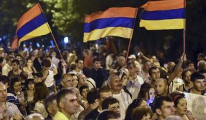 Protesters wave Armenian national flags during a rally in Yerevan, Armenia, on July 1, sparked by a proposed hike in the price of electricity sold by a Russian monopoly. The Iran nuclear deal offers a chance for the West to engage with the countries of the South Caucasus. HAYK BAGHDASARYAN/REUTERS