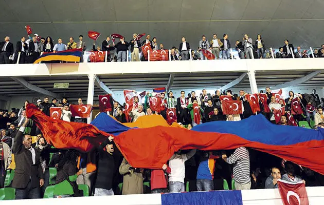 Pride…Armenian fans unfurl their national flag in the Ataturk Stadium before the game in Turkey