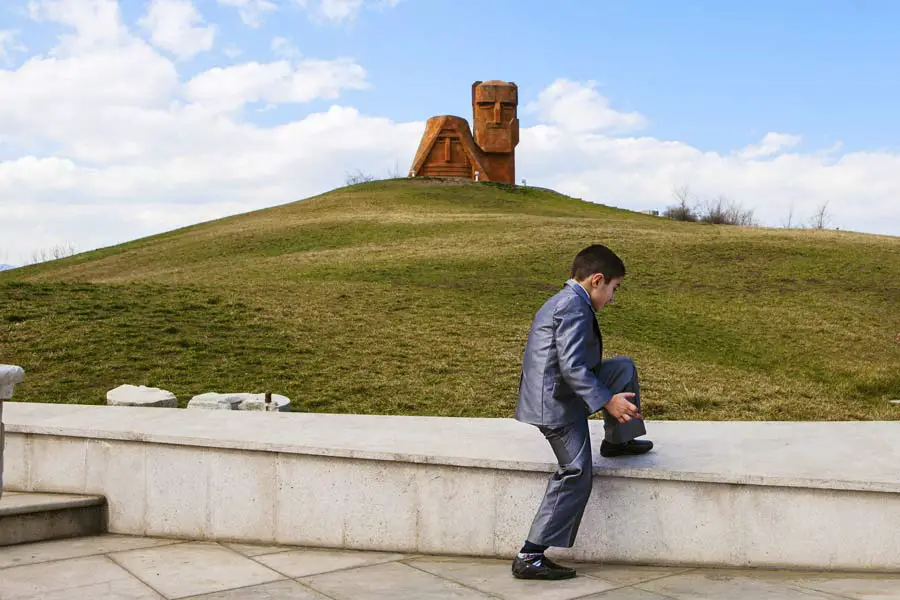 Children from a local private school visit the Tatik-Papik monument, also known as "We Are Our Mountains," which represents the Armenian heritage of Nagorno-Karabakh in Stepanakert, Nagorno-Karabakh Republic. After years of bloody conflict with Azerbaijan for independence, the region's ethnic Armenian majority and Azerbaijan entered a cease-fire. The truce has since been shaken by violence many times, most recently on April 2.
