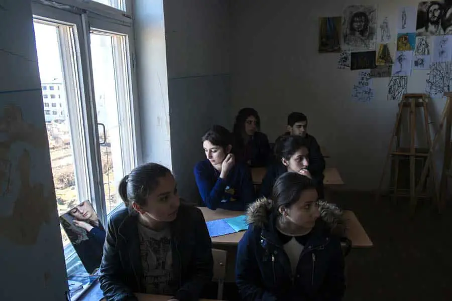 Larisa Davtyan is reflected in a mirror during a painting lesson at Liberal Arts College Arsen Khachatryan, in Shushi. In traditional Karabakh society, women are expected to stay at home and become mothers. A low birth rate means women feel pressure from the government to have as many children as possible. KARL MANCINI, GIANMARCO MARAVIGLIA/ECHO