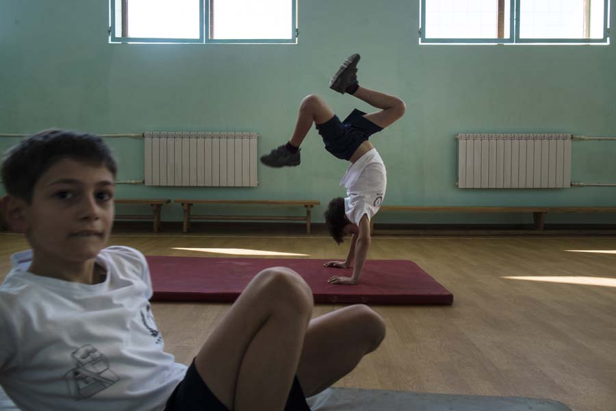 Students play during a gym class in Secondary School Number 1, Khachatur Aboyan in Stepanakert. Wealthy benefactors from the Armenian diaspora have helped finance a handful of venues in Karabakh to help better the lives of the young and their career prospects. KARL MANCINI, GIANMARCO MARAVIGLIA/ECHO