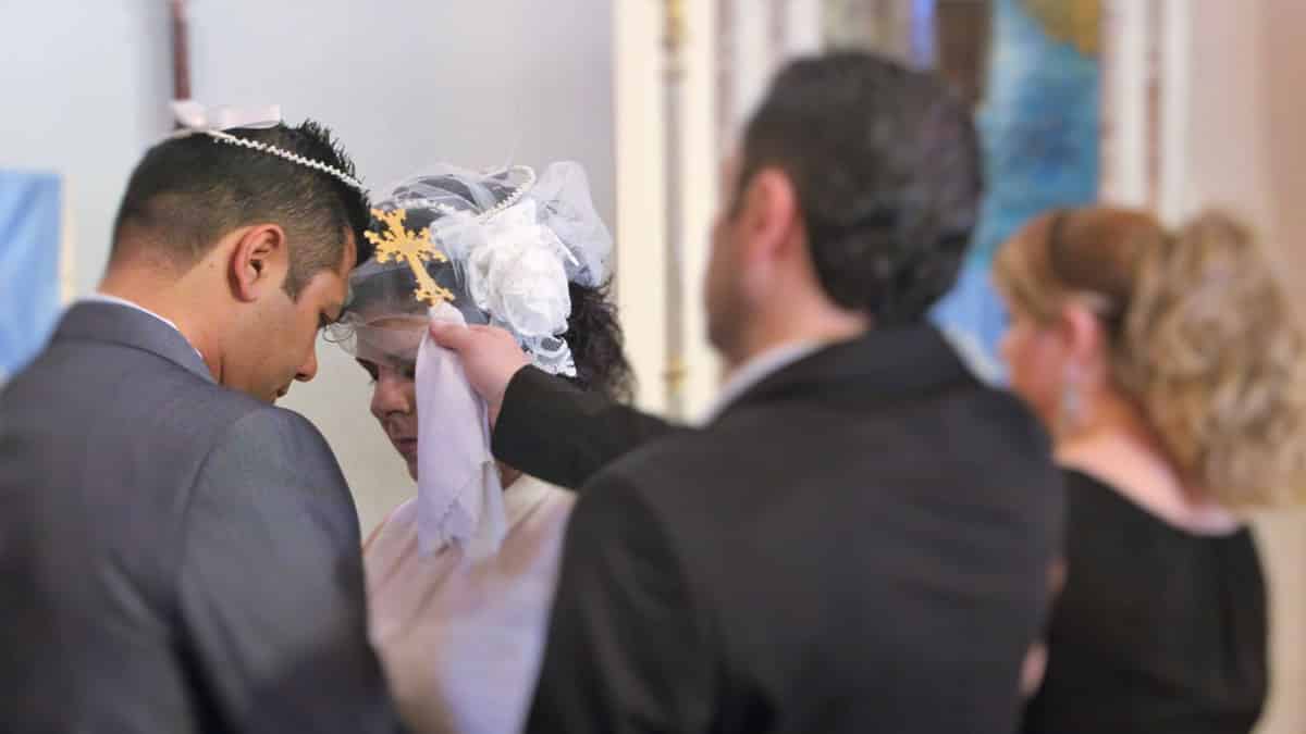 Garo kotchounian and Araz Tavitian getting married in Nicosia Cyprus while "Kavor" holding the Holy Cross between their heads