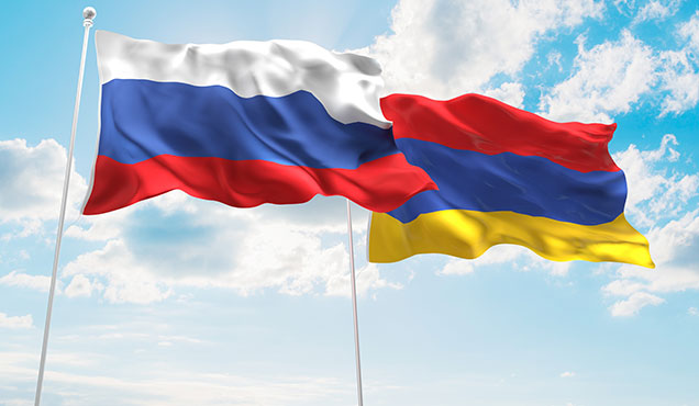 russia-armenia-flags-blue-sky-background