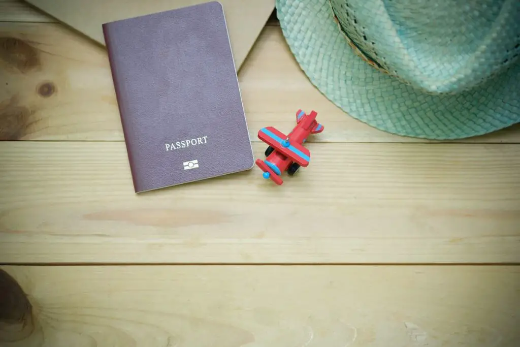 image of a passport and hat on a desk.jpg