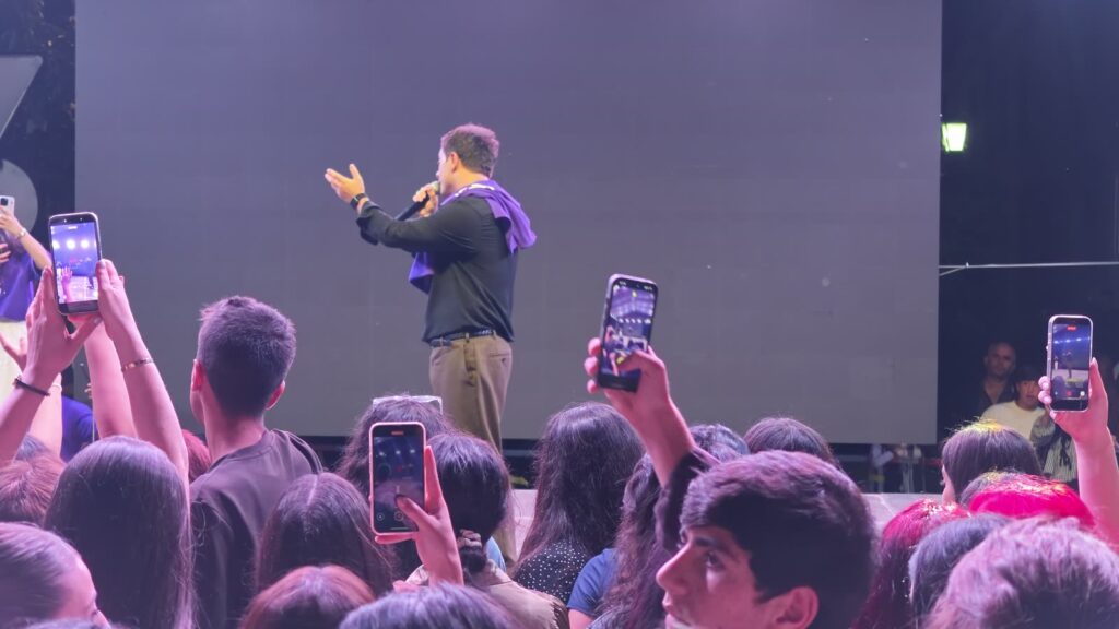 Phones up in front of the screen.